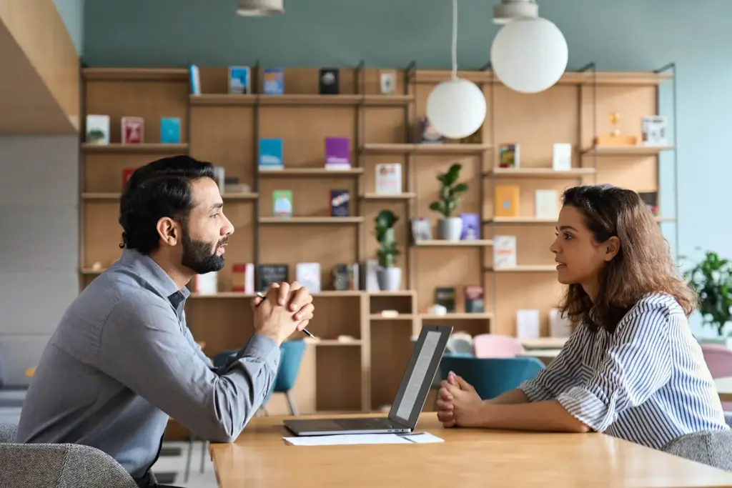 Advisor meeting with a client at a table