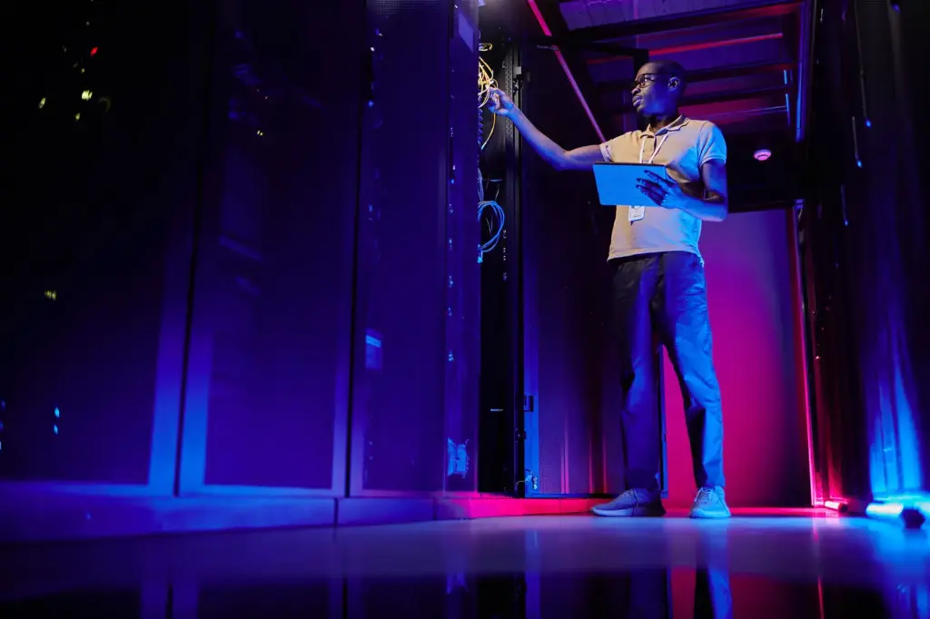 Engineer checking infrastructure in a server room