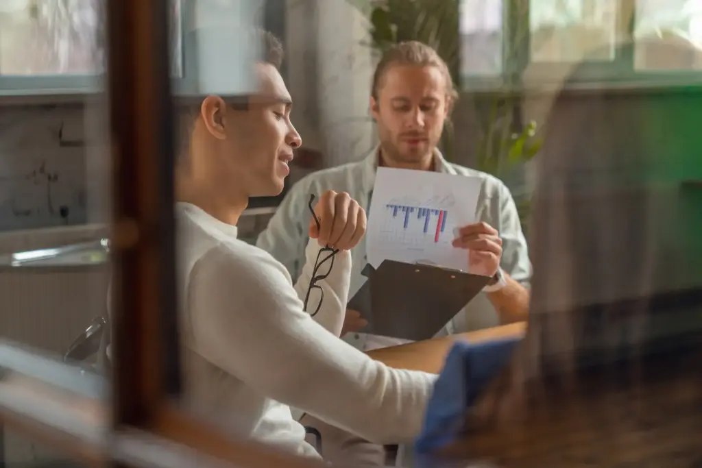 Two colleagues reviewing financial reports