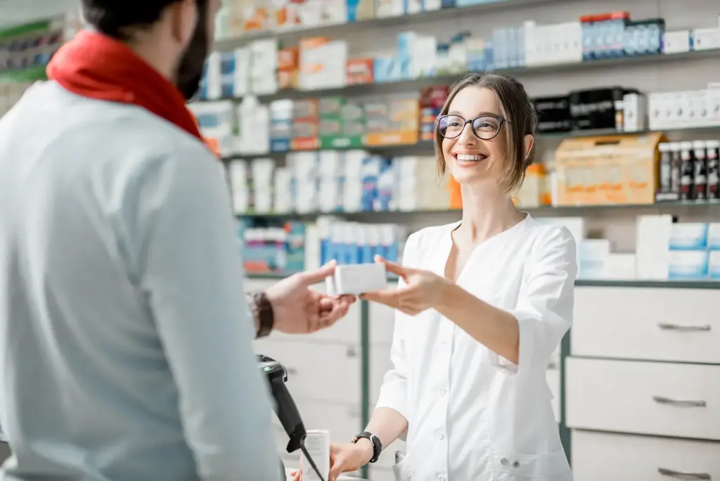 Pharmacist helping a customer at the counter