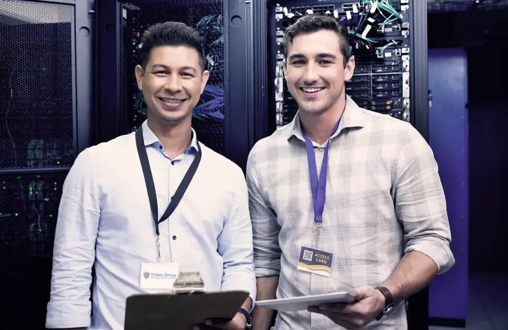 Two security specialists in a server room
