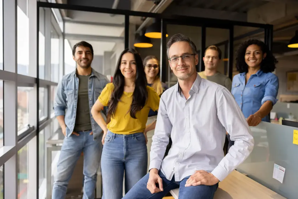 Team smiling together in an office