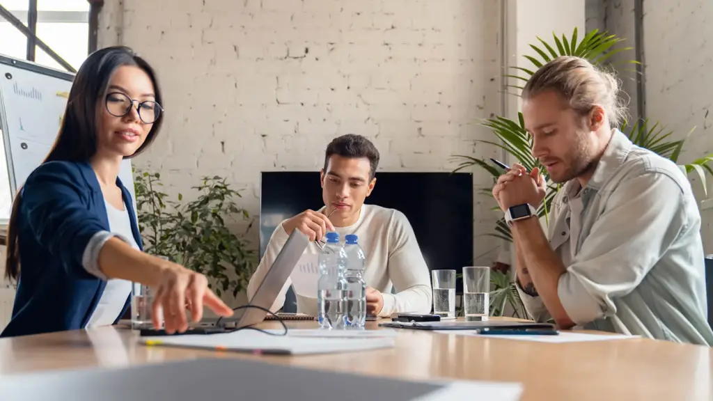 Team reviewing findings around a conference table